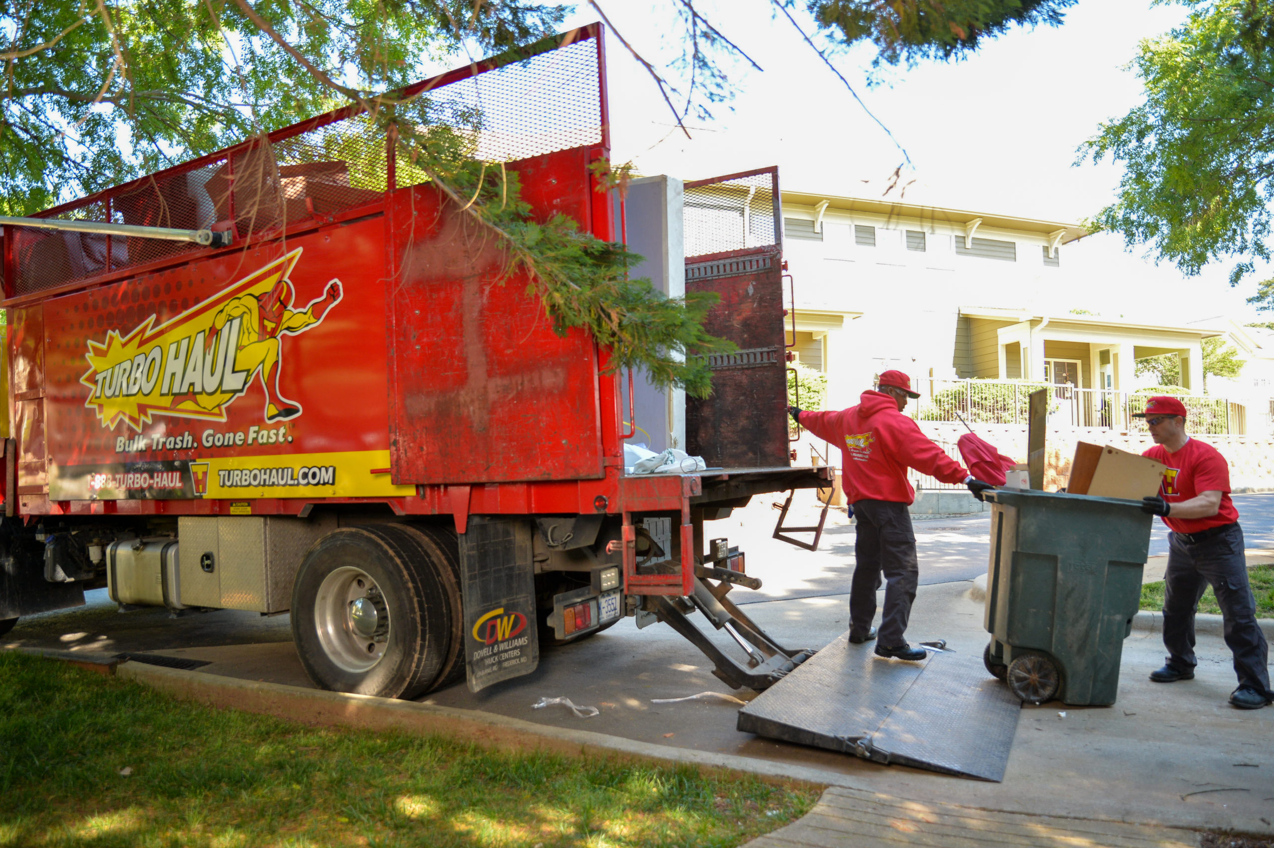 Hillsborough, North Carolina team members load office junk into truck