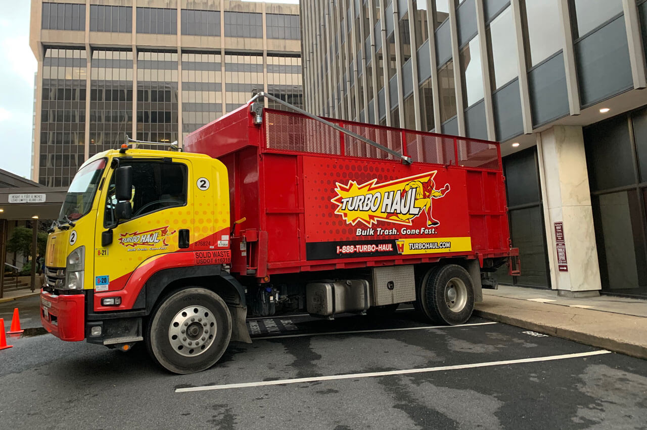 TurboHaul's big red trucks haul more bulk trash and junk than competitors in their service area of Germantown, Maryland.