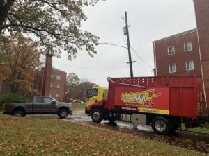 One of TurboHaul's big red truck parked during a junk removal and bulk trash hauling job in McLean, Virginia.