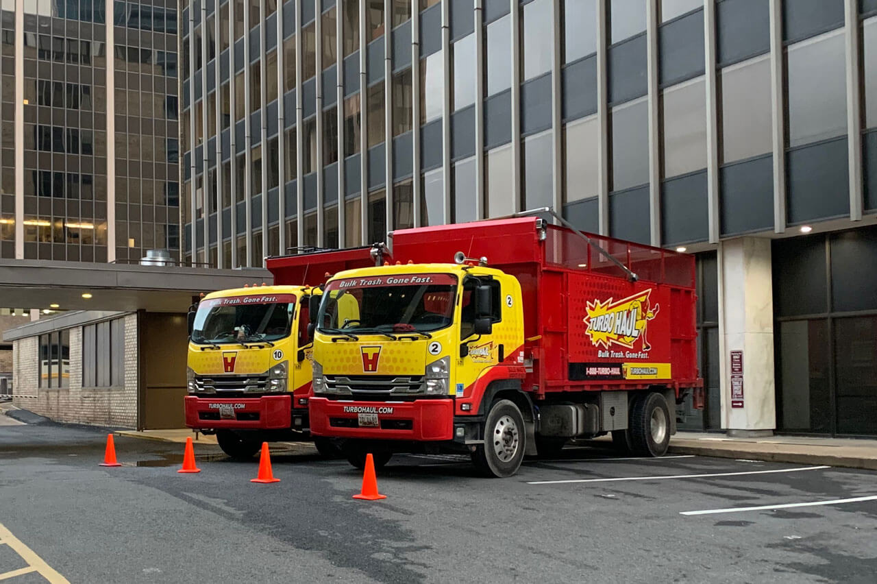 TurboHaul's big red trucks haul more bulk trash and junk than competitors in their service area of Odenton, MD.
