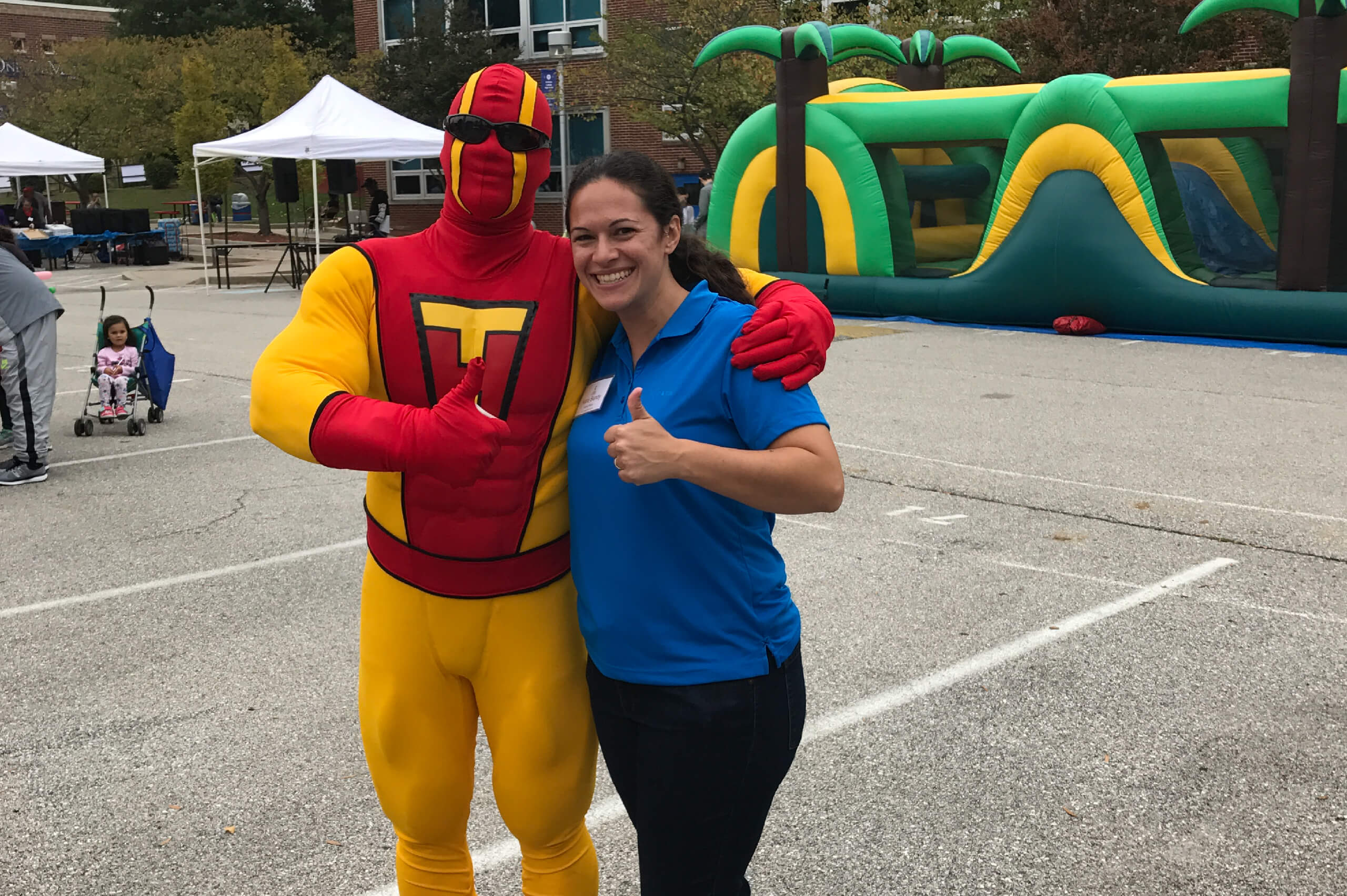 TurboMan poses with a Odenton, Maryland resident at a junk removal event.