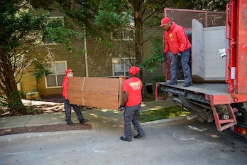 Turbo Haul workers loading items onto a truck
