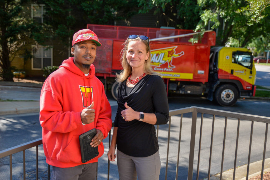 Richmond, VA bulk trash removal specialist and customer give thumbs up