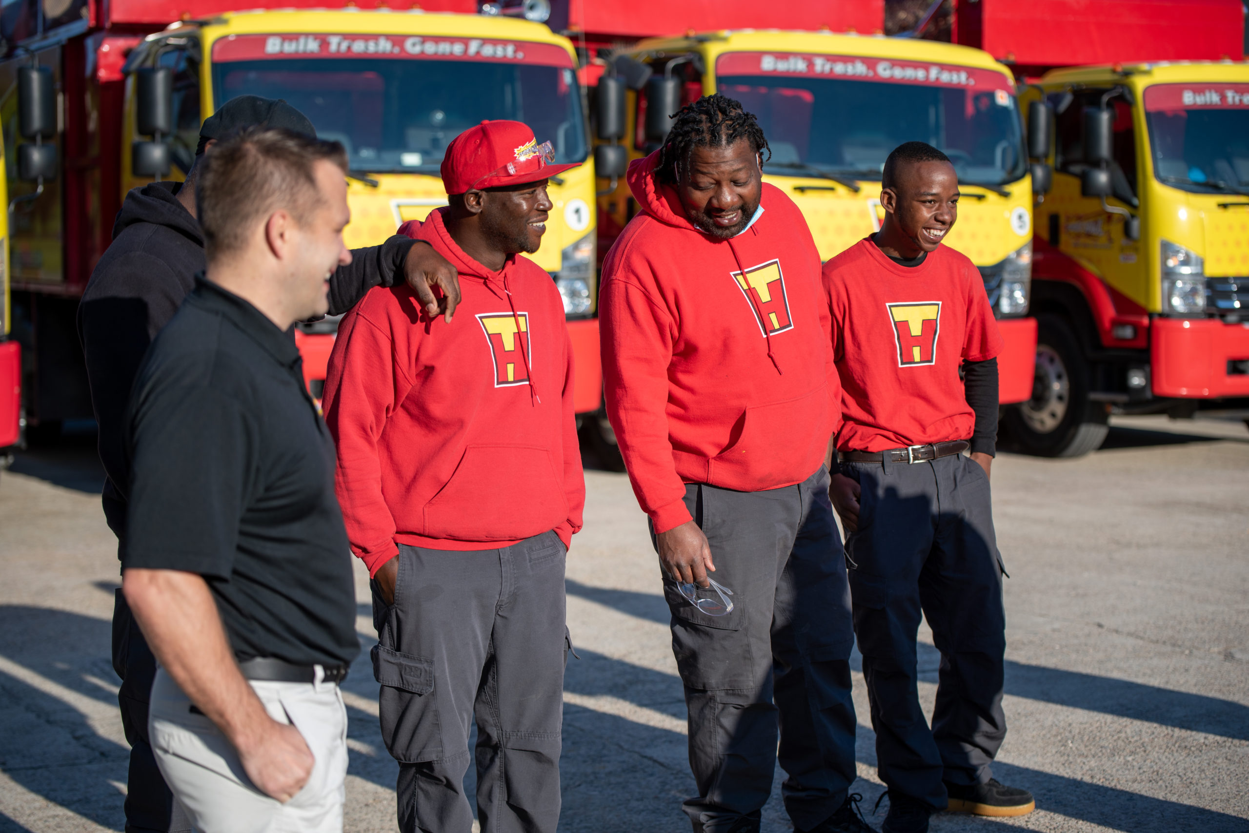 TurboHaul employees stand in front of their trucks in Riverdale, MD
